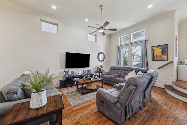 living area featuring ornamental molding, recessed lighting, stairs, and wood finished floors