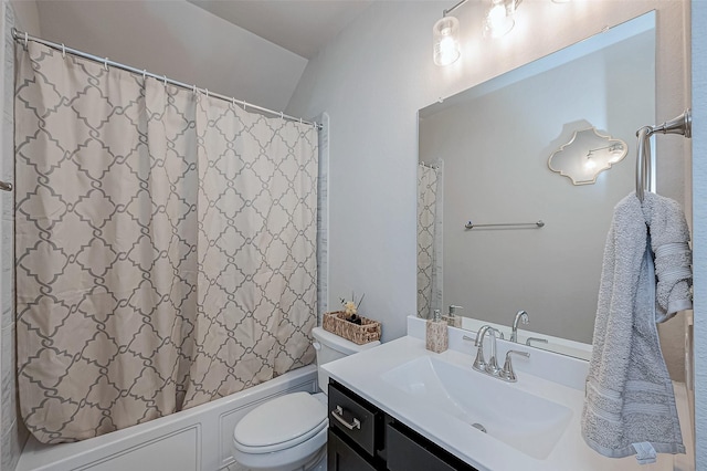 bathroom with toilet, vanity, and shower / bathtub combination with curtain