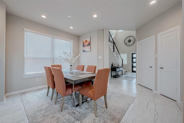 dining room with marble finish floor, stairs, baseboards, and recessed lighting