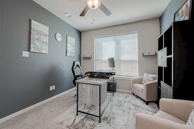 home office featuring visible vents, ceiling fan, light carpet, and baseboards