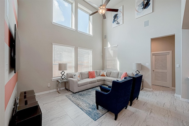 living room featuring marble finish floor, visible vents, ceiling fan, and baseboards