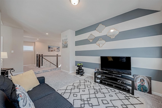 carpeted living area featuring baseboards