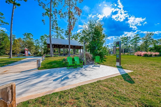 view of community with a yard and playground community