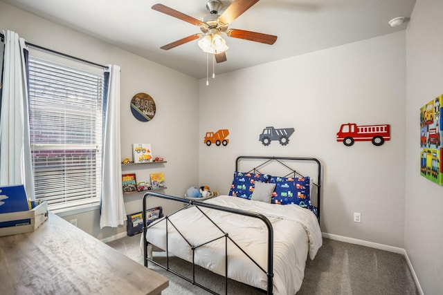 bedroom with carpet floors, baseboards, and a ceiling fan