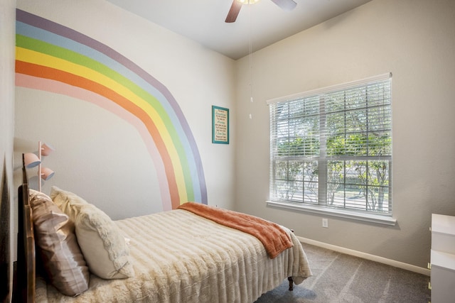 bedroom with a ceiling fan, carpet, and baseboards