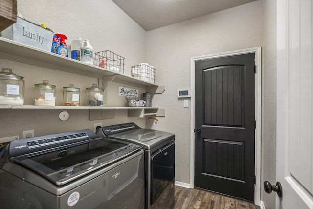 laundry room featuring laundry area, baseboards, washer and clothes dryer, and dark wood-type flooring