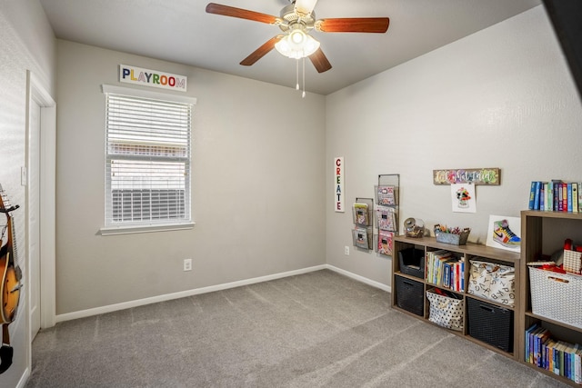 rec room featuring a ceiling fan, carpet, and baseboards