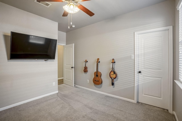 interior space featuring carpet floors, baseboards, and visible vents