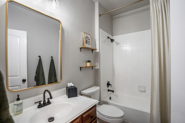 full bathroom with toilet, a textured wall, shower / bath combo with shower curtain, and vanity