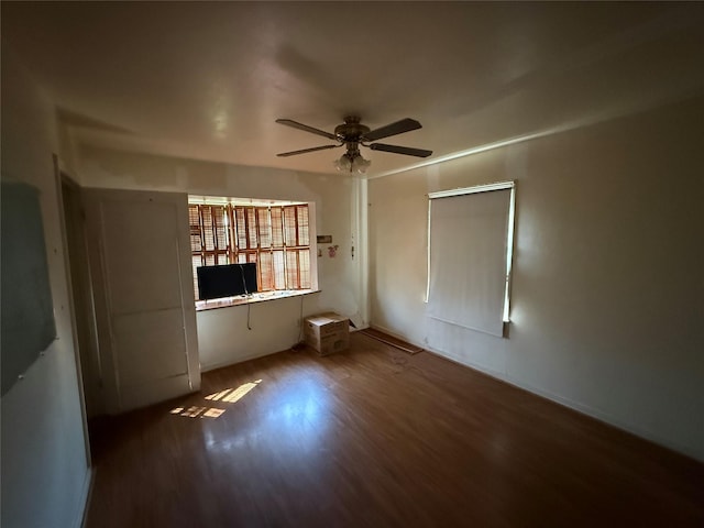 unfurnished bedroom with ceiling fan and wood finished floors