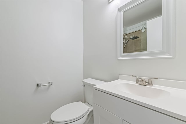 bathroom with toilet and vanity