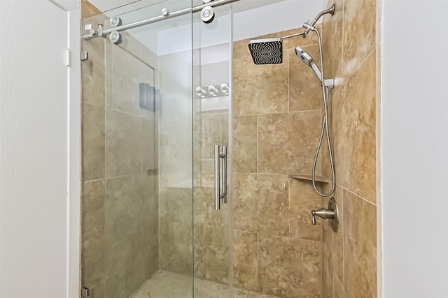 bathroom with a shower stall