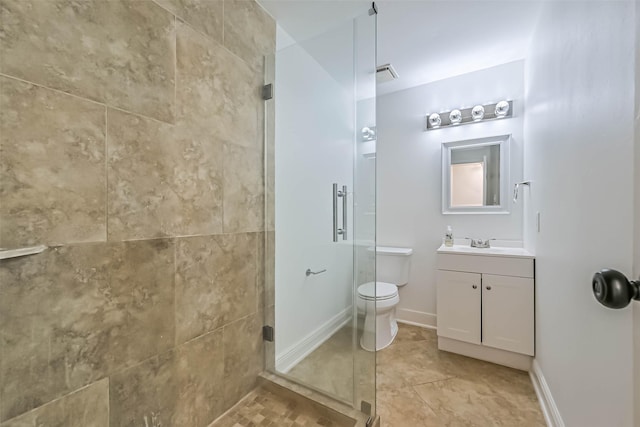 full bath featuring a stall shower, baseboards, vanity, and toilet