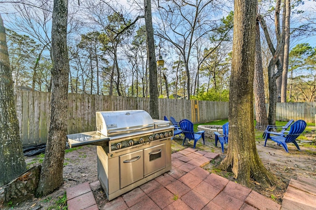 view of patio with a fenced backyard and grilling area