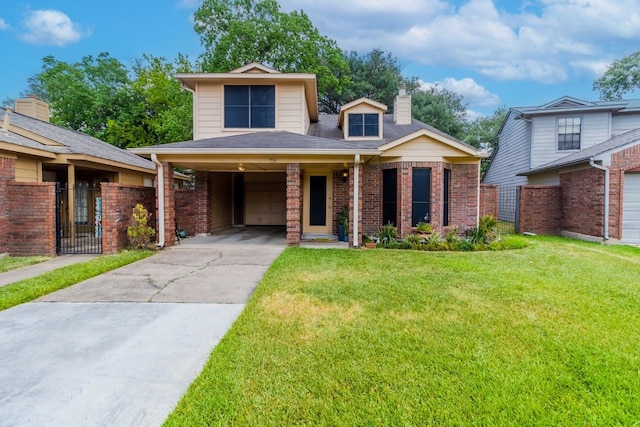 view of front of house with a front yard, brick siding, driveway, and fence