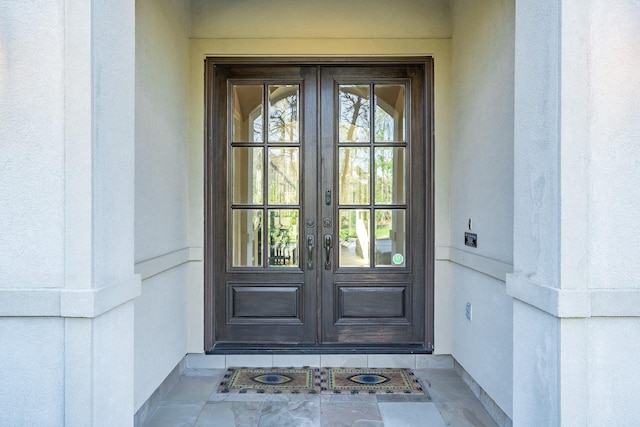 doorway to property featuring french doors