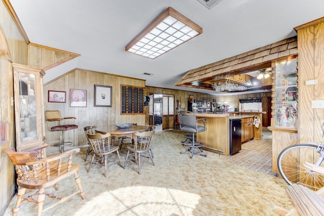 kitchen with visible vents and a kitchen breakfast bar