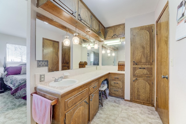 bathroom featuring connected bathroom and vanity