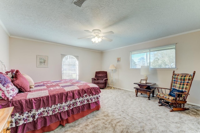 bedroom featuring carpet flooring, a ceiling fan, baseboards, visible vents, and crown molding