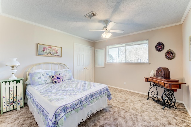 bedroom featuring baseboards, crown molding, visible vents, and carpet flooring