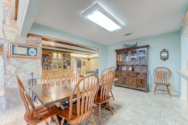 dining area featuring visible vents and baseboards