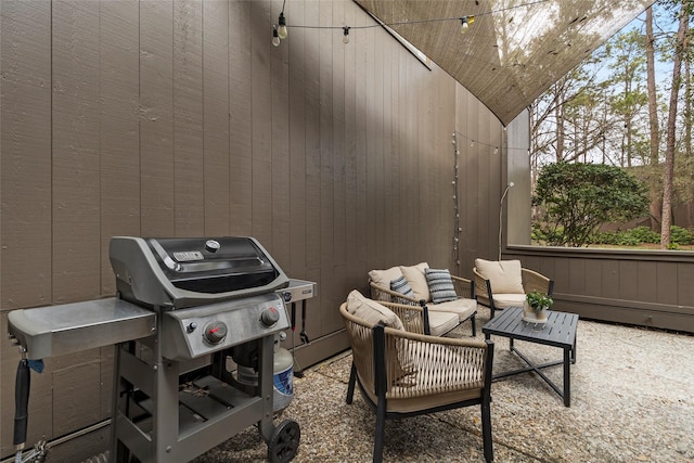 view of patio with grilling area and outdoor lounge area