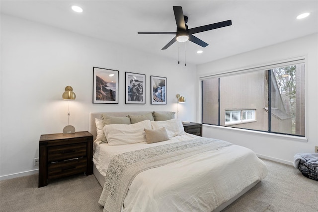 carpeted bedroom featuring ceiling fan, baseboards, and recessed lighting