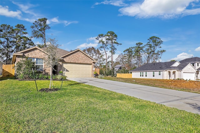 187 Deer Lake Rd, Huffman, TX 77336 - view of front of home with brick siding, concrete driveway, an attached garage, fence, and a front lawn