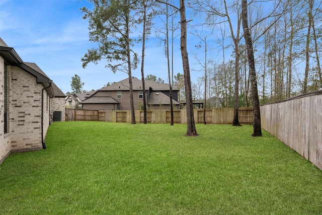 view of yard featuring cooling unit and a fenced backyard