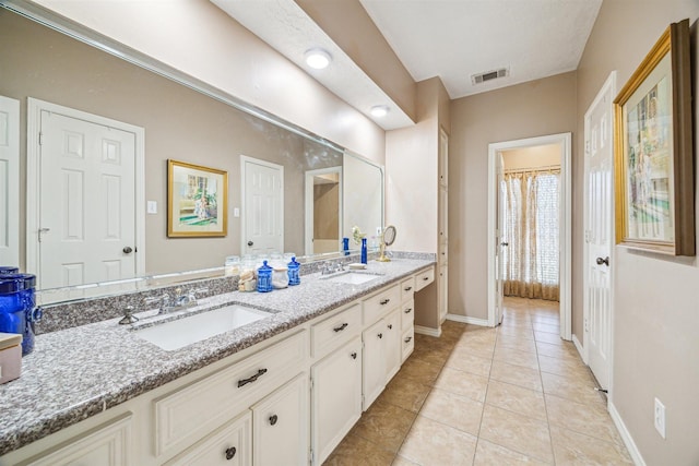 full bathroom with tile patterned flooring, visible vents, a sink, and double vanity