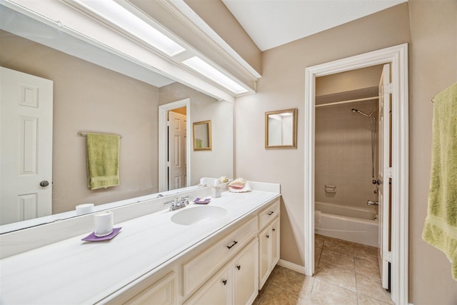 bathroom featuring tile patterned floors, shower / tub combination, baseboards, and vanity