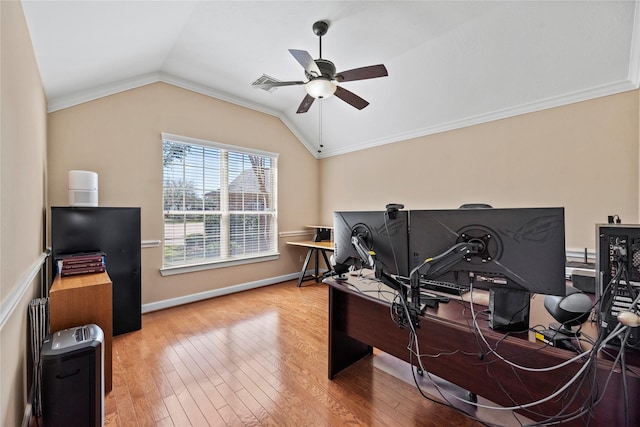 home office featuring a ceiling fan, lofted ceiling, ornamental molding, and hardwood / wood-style flooring