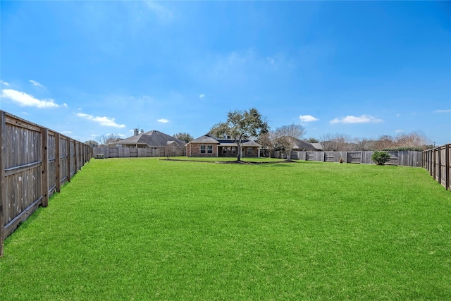 view of yard with a fenced backyard