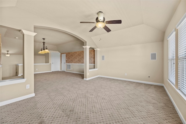 unfurnished living room with carpet, decorative columns, lofted ceiling, visible vents, and ceiling fan