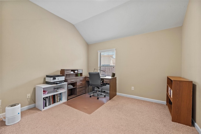 office space with vaulted ceiling, carpet floors, and baseboards