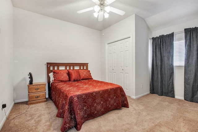 bedroom with ceiling fan, a closet, baseboards, and carpet flooring