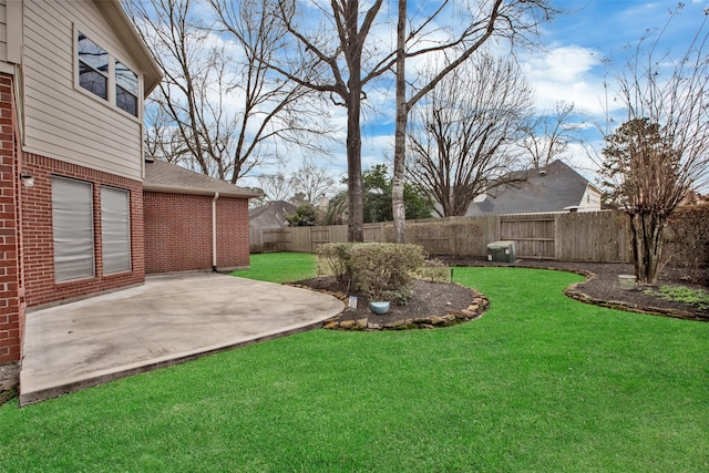 view of yard with a fenced backyard and a patio