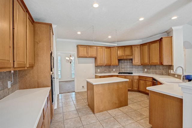 kitchen featuring light tile patterned floors, a kitchen island, a sink, appliances with stainless steel finishes, and decorative backsplash