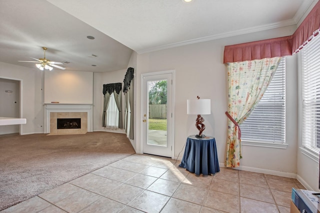 living room featuring light carpet, light tile patterned floors, and a wealth of natural light