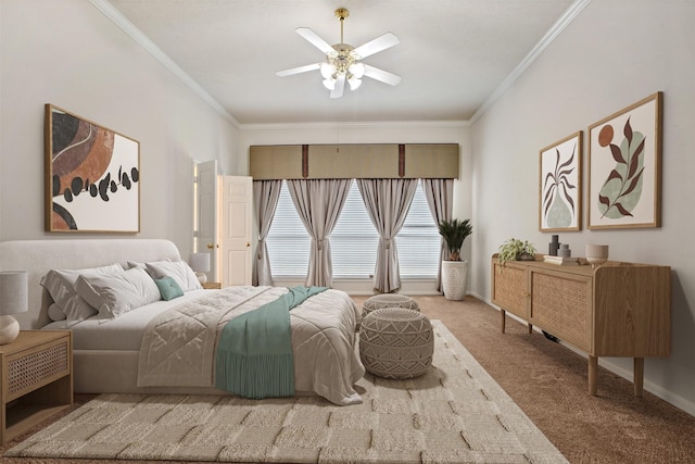 carpeted bedroom with a ceiling fan, crown molding, and baseboards