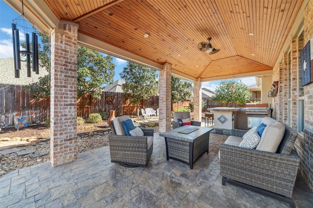 view of patio / terrace with a fenced backyard, a grill, area for grilling, and an outdoor hangout area