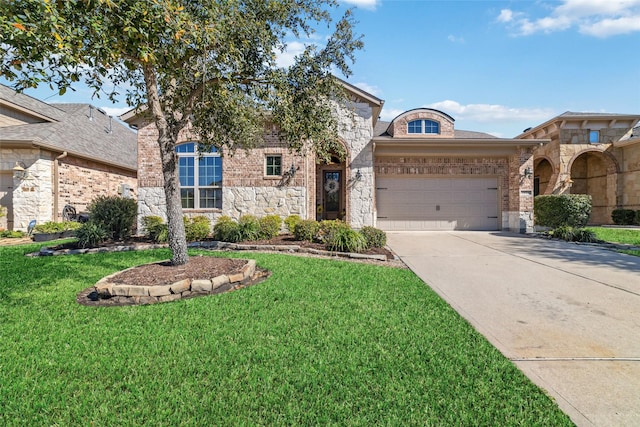 view of front of property featuring driveway, stone siding, an attached garage, a front yard, and brick siding