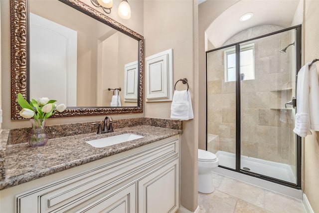 full bath with toilet, a shower stall, and vanity