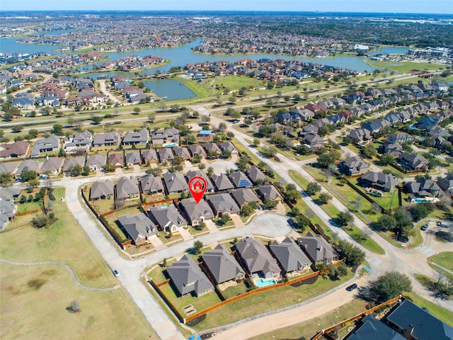 aerial view with a residential view and a water view