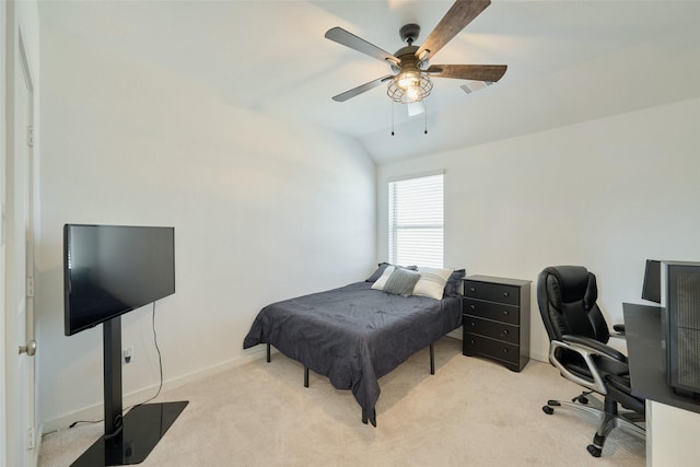 bedroom with carpet flooring, vaulted ceiling, baseboards, and ceiling fan