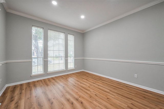 unfurnished room featuring ornamental molding and baseboards