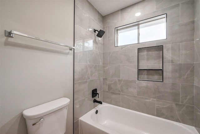 bathroom featuring shower / bathing tub combination and toilet