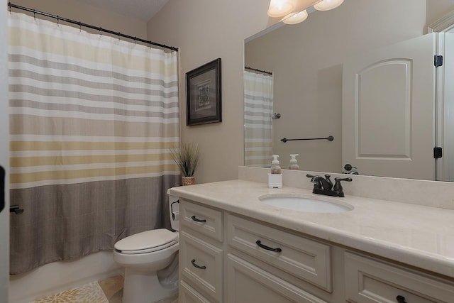 bathroom featuring toilet, shower / bathtub combination with curtain, and vanity