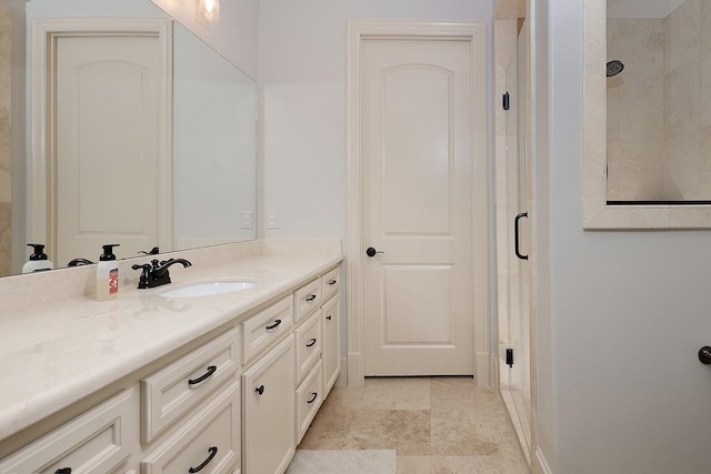 full bath featuring a stall shower and vanity