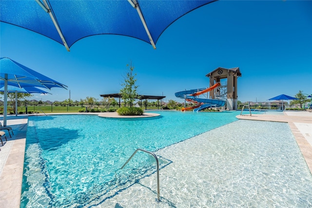 view of swimming pool featuring a water slide